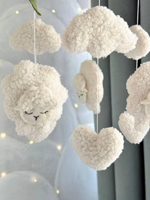 Handmade felt Sheep & Cloud Baby Mobile hanging from a wooden hoop