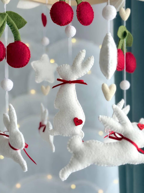 Handmade felt Cherry Bunny Baby Mobile hanging from a wooden hoop