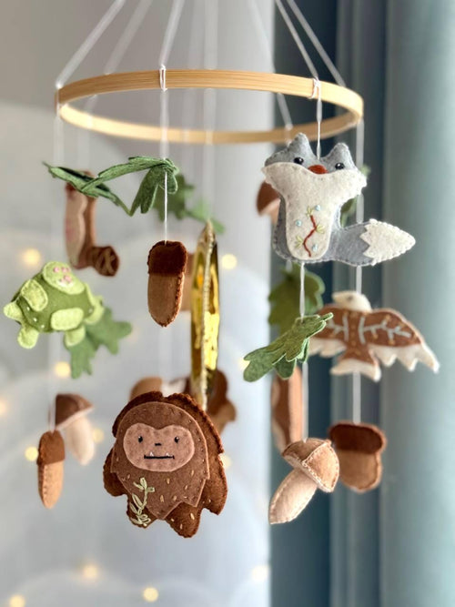 Handmade felt Forest Animals Baby Mobile hanging from a wooden hoop
