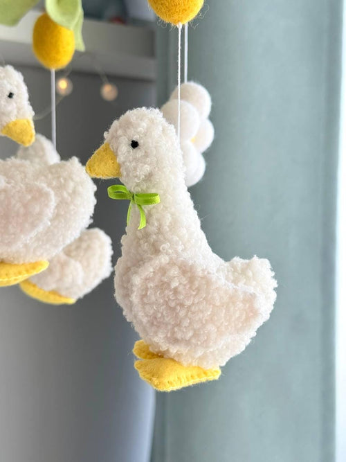Handmade felt Fluffy Goose Baby Mobile hanging from a wooden hoop