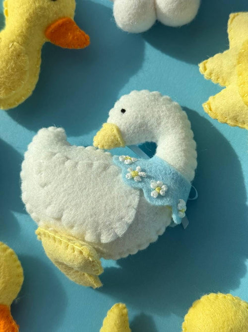 Handmade felt Mama Duck & Ducklings Mobile hanging from a wooden hoop