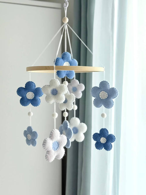 Handmade felt Daisy Baby Mobile hanging from a wooden hoop