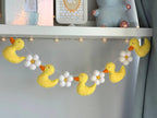 Yellow Ducks with Flowers Banner