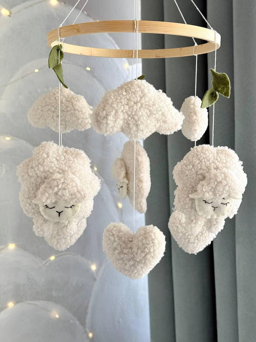 Handmade felt Sheep & Cloud Baby Mobile hanging from a wooden hoop