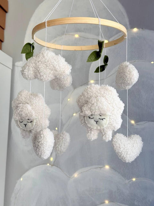 Handmade felt Sheep & Cloud Baby Mobile hanging from a wooden hoop