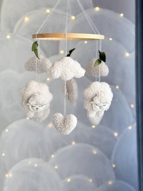 Handmade felt Sheep & Cloud Baby Mobile hanging from a wooden hoop