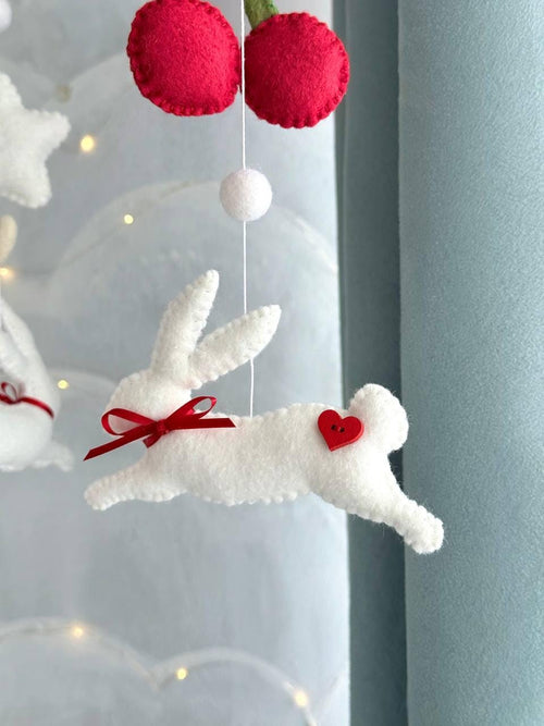 Handmade felt Cherry Bunny Baby Mobile hanging from a wooden hoop
