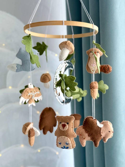 Handmade felt Seven Teachings Forest Mobile hanging from a wooden hoop