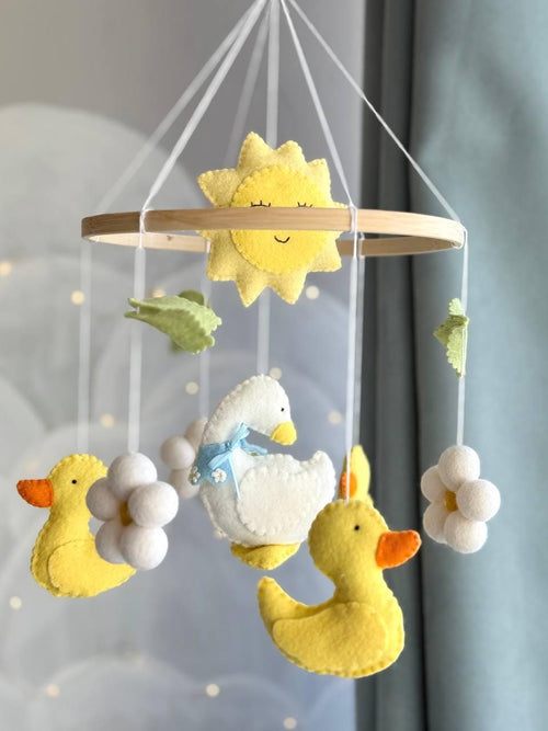 Handmade felt Mama Duck & Ducklings Mobile hanging from a wooden hoop