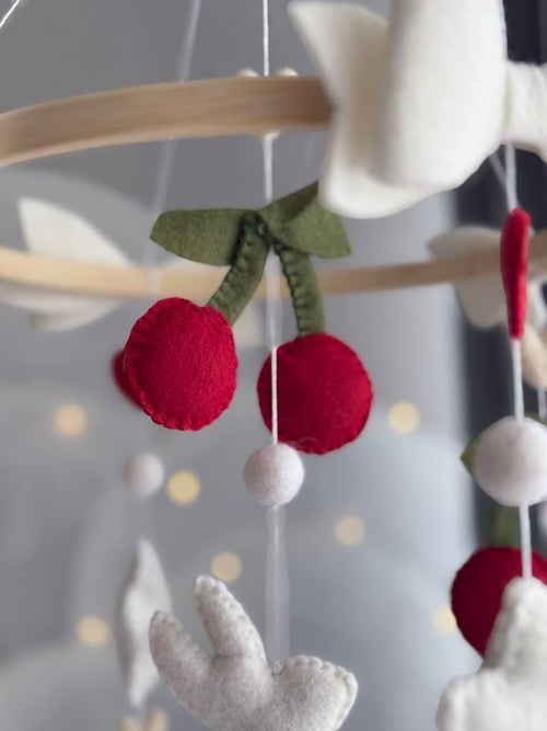 Handmade felt Cherry Bunny Baby Mobile hanging from a wooden hoop