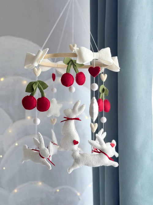 Handmade felt Cherry Bunny Baby Mobile hanging from a wooden hoop
