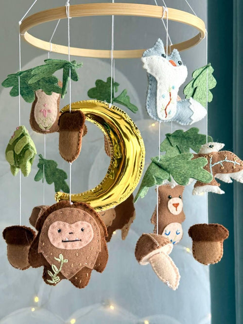 Handmade felt Forest Animals Baby Mobile hanging from a wooden hoop