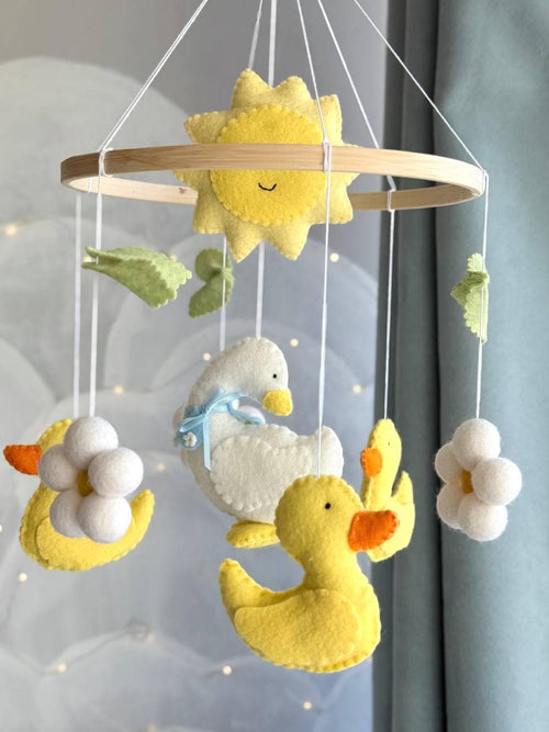 Handmade felt Mama Duck & Ducklings Mobile hanging from a wooden hoop