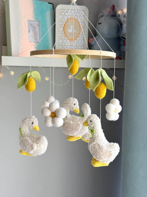 Handmade felt Fluffy Goose Baby Mobile hanging from a wooden hoop