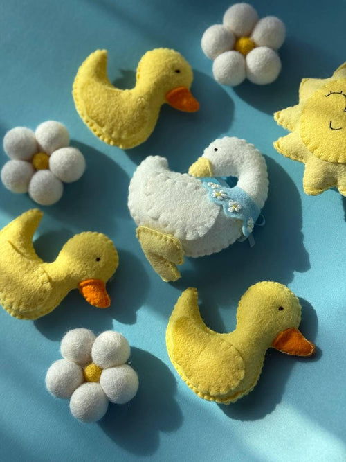 Handmade felt Mama Duck & Ducklings Mobile hanging from a wooden hoop