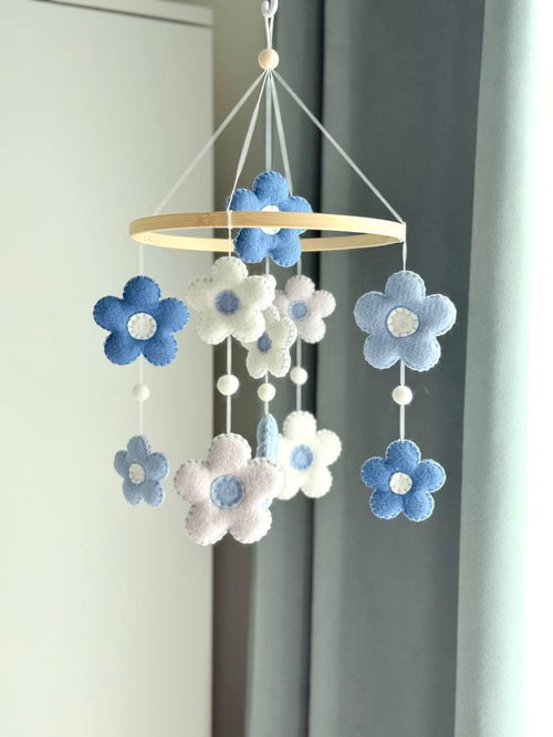 Handmade felt Daisy Baby Mobile hanging from a wooden hoop