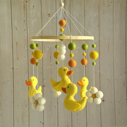 Handmade felt Yellow Duck Baby Mobile hanging from a wooden hoop