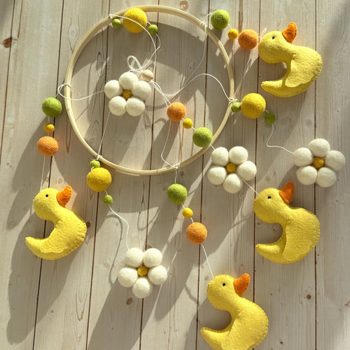 Handmade felt Yellow Duck Baby Mobile hanging from a wooden hoop