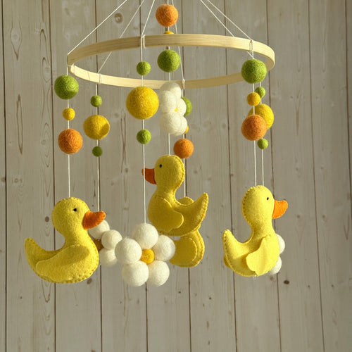Handmade felt Yellow Duck Baby Mobile hanging from a wooden hoop