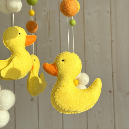 Handmade felt Yellow Duck Baby Mobile hanging from a wooden hoop
